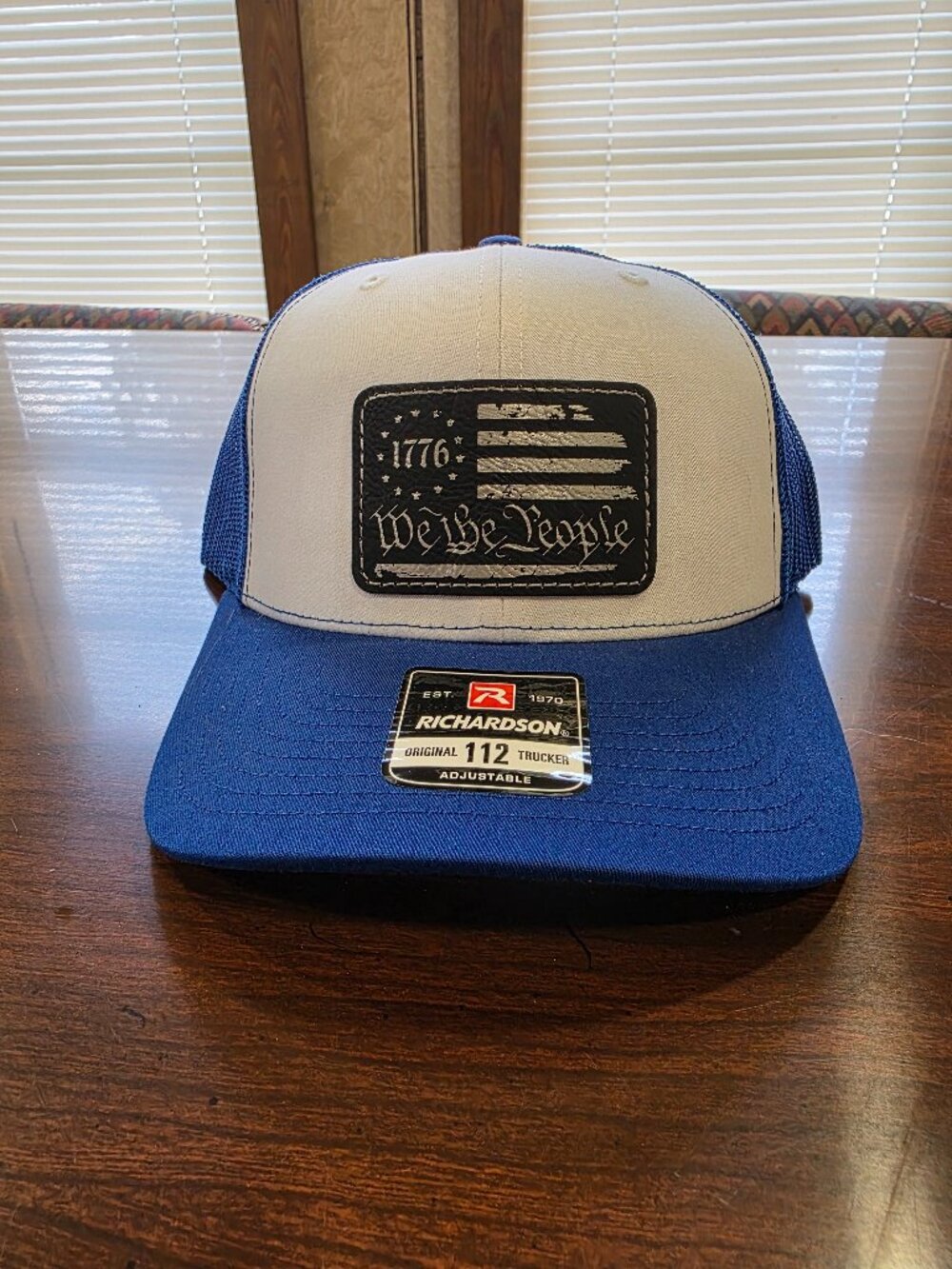 Richardson Blue/White Adjustable Mesh Back Trucker Hat "We The People" Patch
